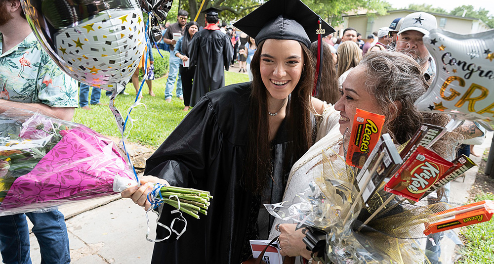 Graduating student celebrating 