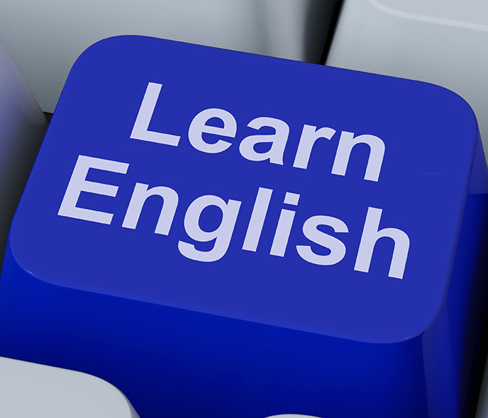 A blue computer keyboard button that says 'Learn English'