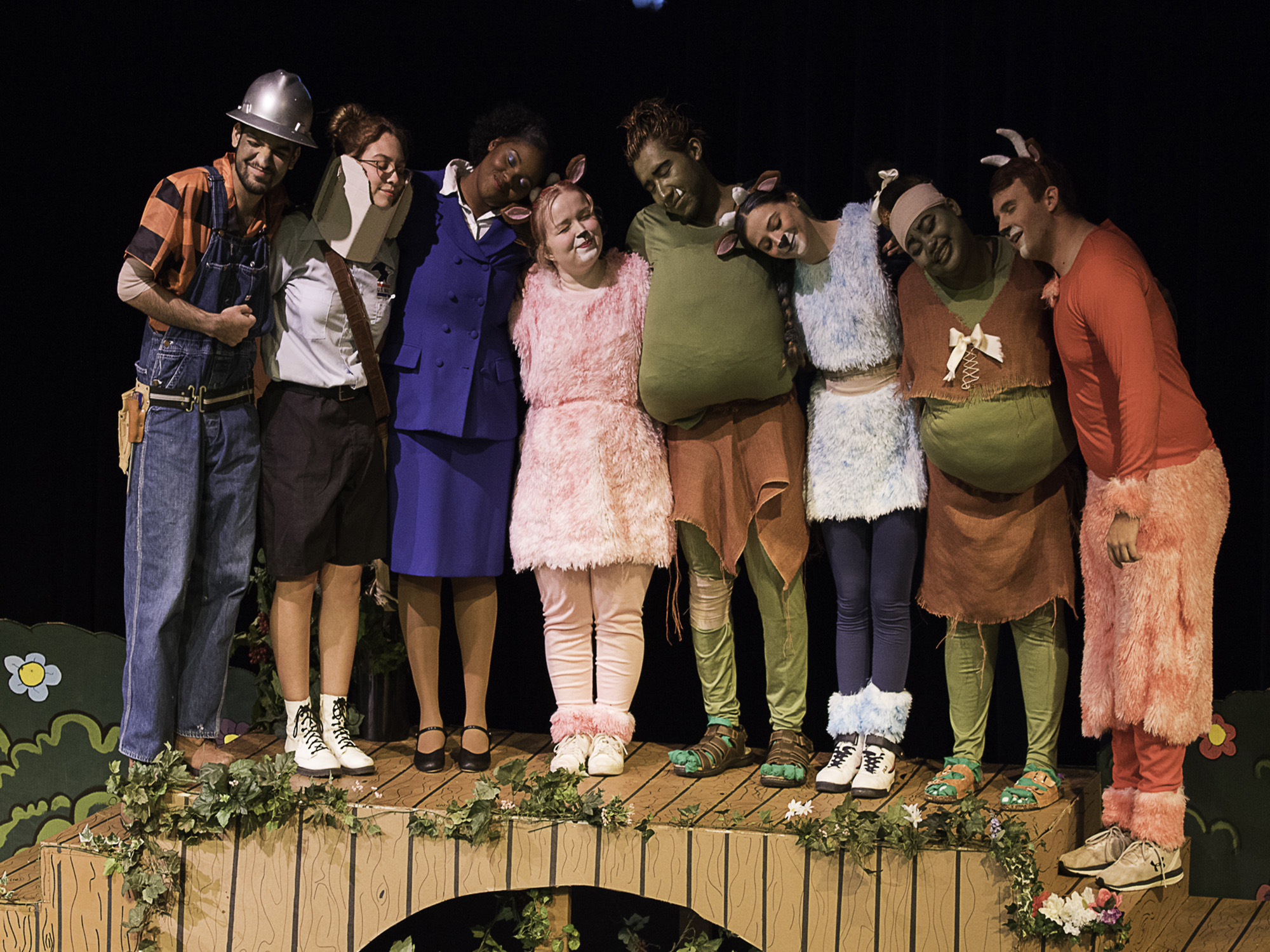 Students lined up hugging in their costumes