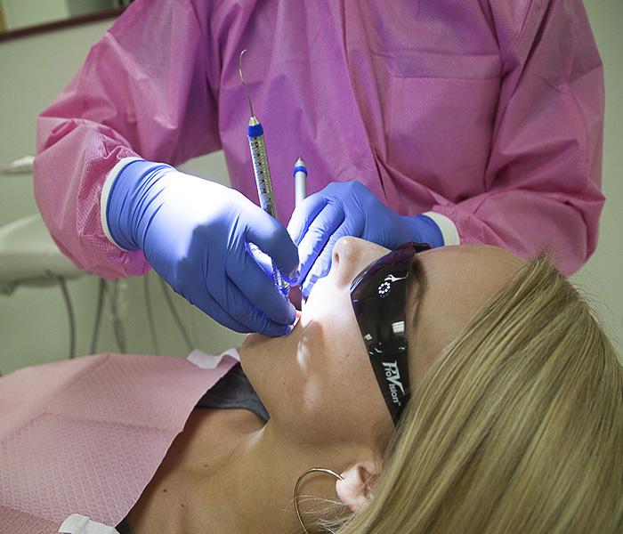 Dental work being performed on a blond woman