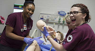 Nurse training to deliver a baby