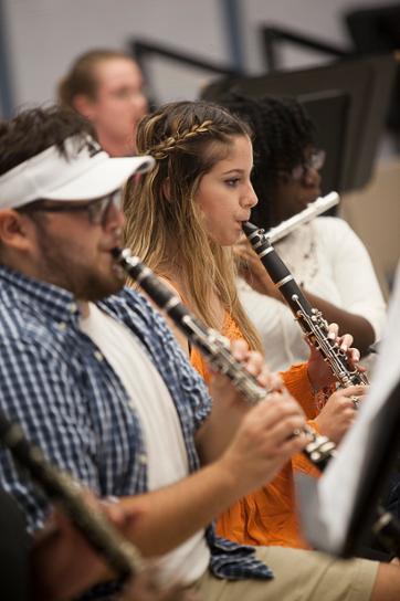 Wharton County Junior College band members, from left, Evan Stavena, Rocio Alanis and Destiny Denton rehearse for the upcoming Country and Western concert. 