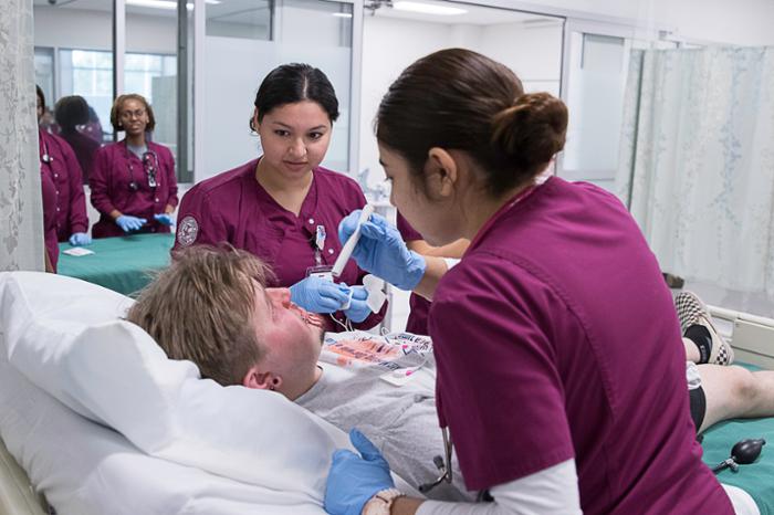 Wharton County Junior College nursing students participate in a training exercise at the Wharton campus. The college will launch a new Continuing Education Patient Care Technician program later this spring, providing 30 qualified students with full scholarships. 