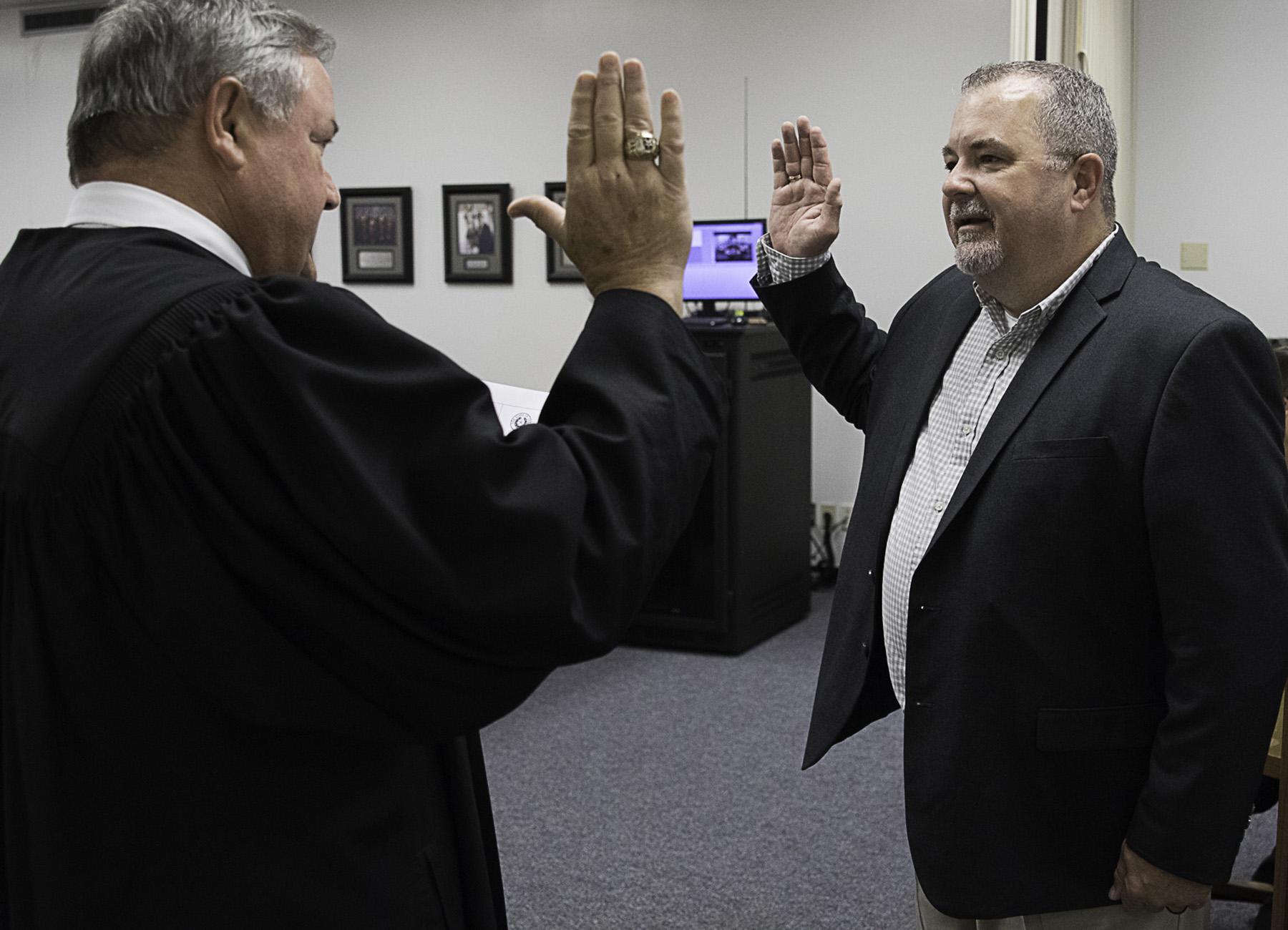 Elected members of the Wharton County Junior College Board of Trustees were officially sworn in during the regularly scheduled meeting on Tuesday, May 21, 2024. Pictured is State District Judge Randy Clapp, right, swearing in board member Terry Lynch, who was elected to Position 7.