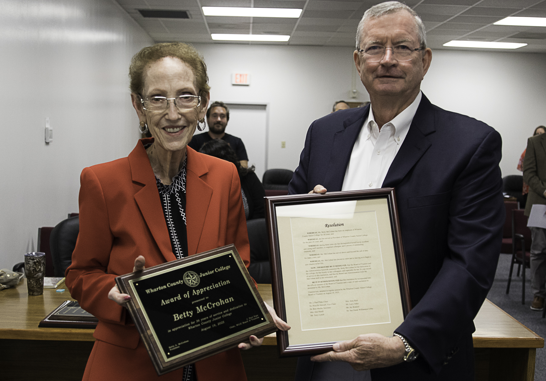 WCJC Board of Trustees Chair J. Paul Pope presents a plaque and resolution to Betty McCrohan upon her retirement.