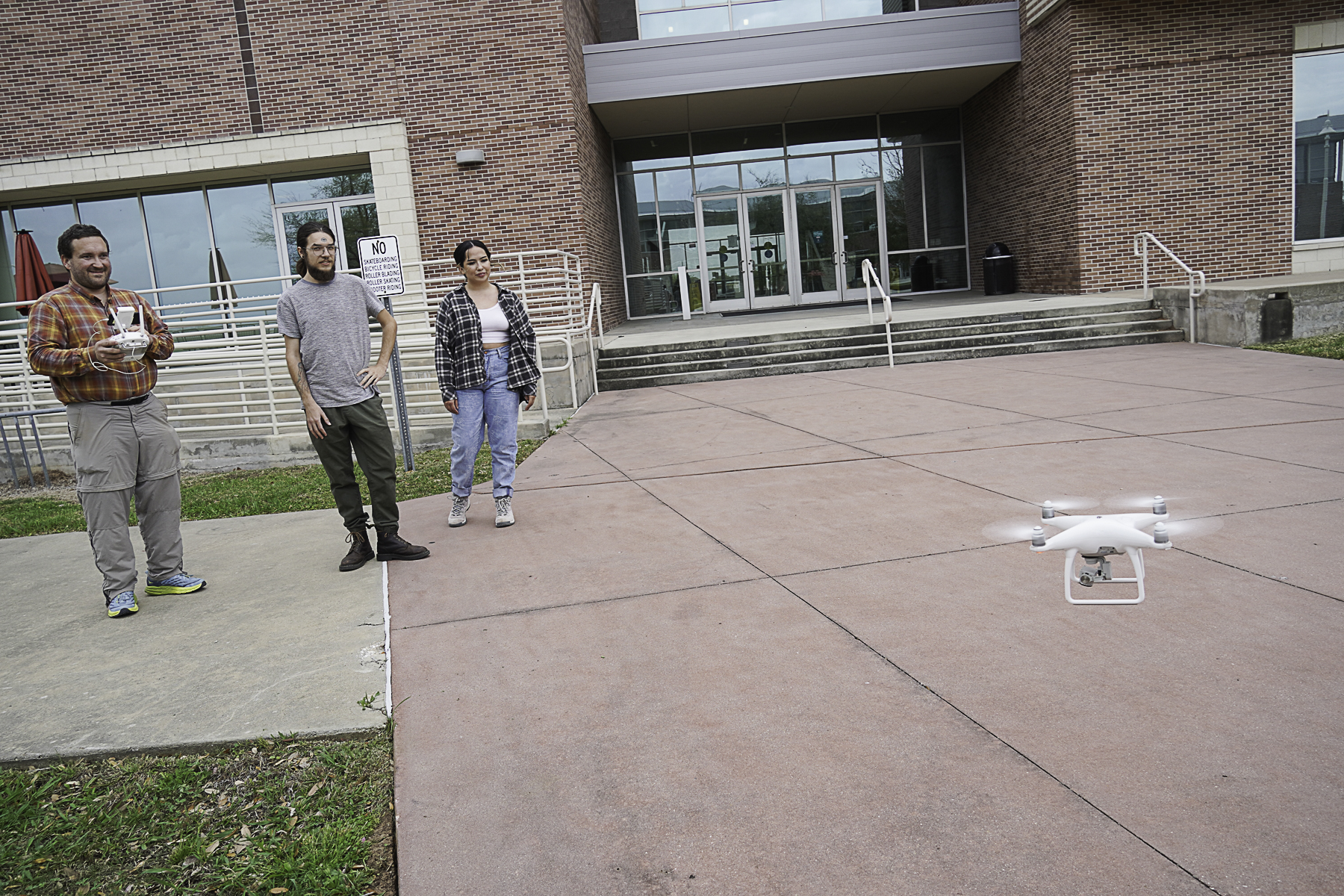 A National Science Foundation grant will help Wharton County Junior College provide hands-on learning for geology students. Pictured are WCJC Geology Instructor Peter Anderson operating a drone while students Anthony McKean of Clearlake, Calif., and Emily Gonzales of El Campo look on. 