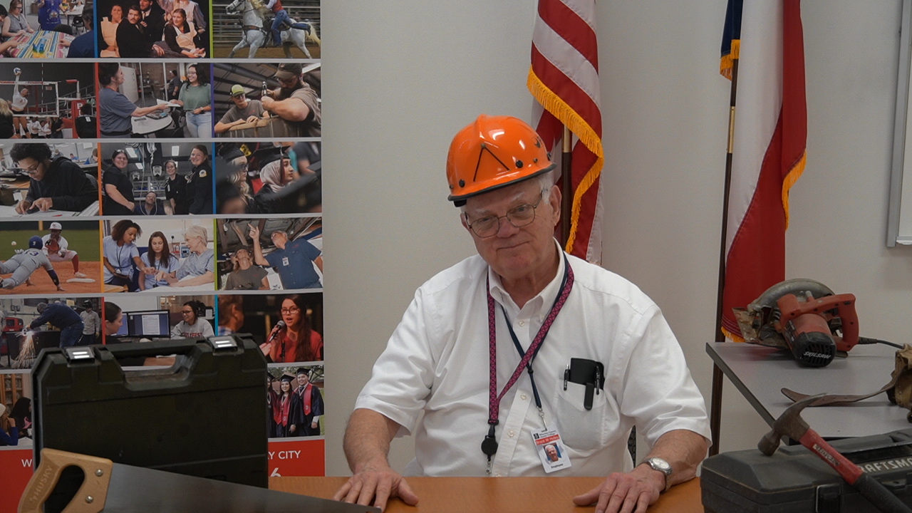 Wharton County Junior College Carpentry Instructor Bruce Holley displays some of the tools students will use in the General Carpentry Level I program.