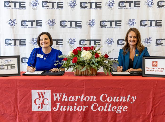 Wharton County Junior College and Lamar Consolidated Independent School District this month signed a dual credit partnership agreement that will create new pathways for dual credit students. Pictured signing the document are, from left, Lamar CISD Executive Director of CTE Dr. Kayse Lazar and WCJC President Dr. Amanda Allen.