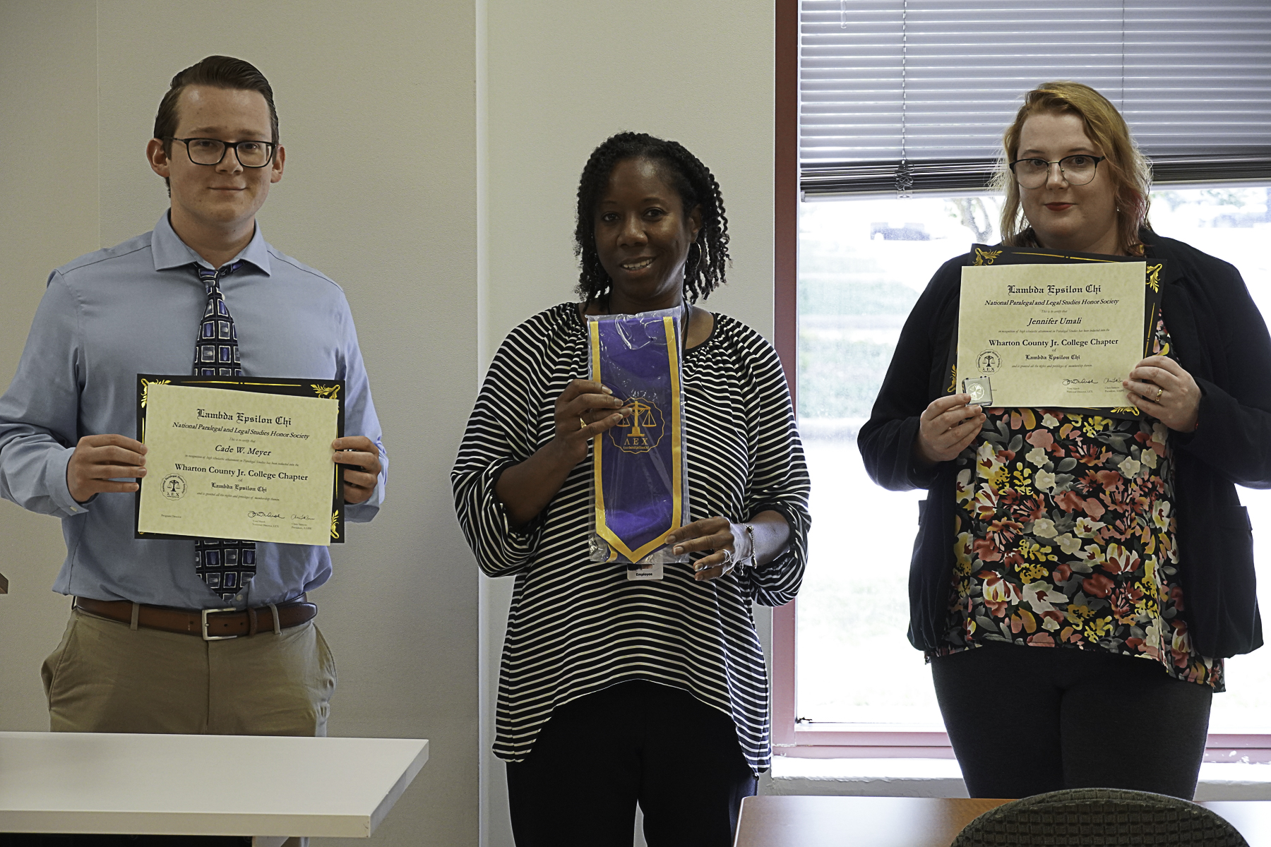 Wharton County Junior College recently hosted a Law Day event at the Richmond campus. During the event, two students were inducted into the Lambda Epsilon Chi legal honor society. From left are Cade Meyer of Needville, WCJC Paralegal Studies Program Director Dr. Erma Hart and Jennifer Umali of Richmond. 