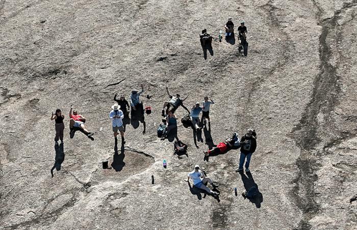 Wharton County Junior College geology students and faculty take a photograph with a drone while visiting Enchanted Rock in the Texas Hill Country. A National Science Foundation grant will enable the college to purchase additional drones and training equipment.