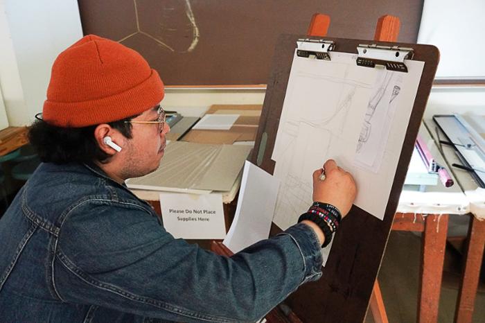 Wharton County Junior College art student Yojani Flores works on a sketch as part of a class assignment. Students' artwork is now on display in the Duson-Hansen Fine Arts Building on the Wharton campus as part of a student art show.
